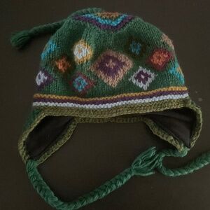 RISING TIDE WOOl KNIT WINTER HAT. With fleece lining and ear flaps. NWOT